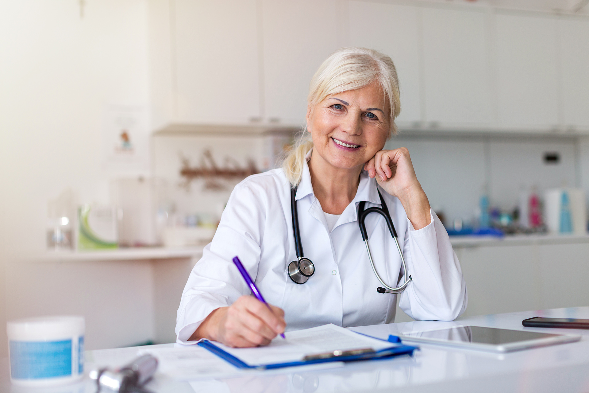 Senior female doctor smiling at the camera
